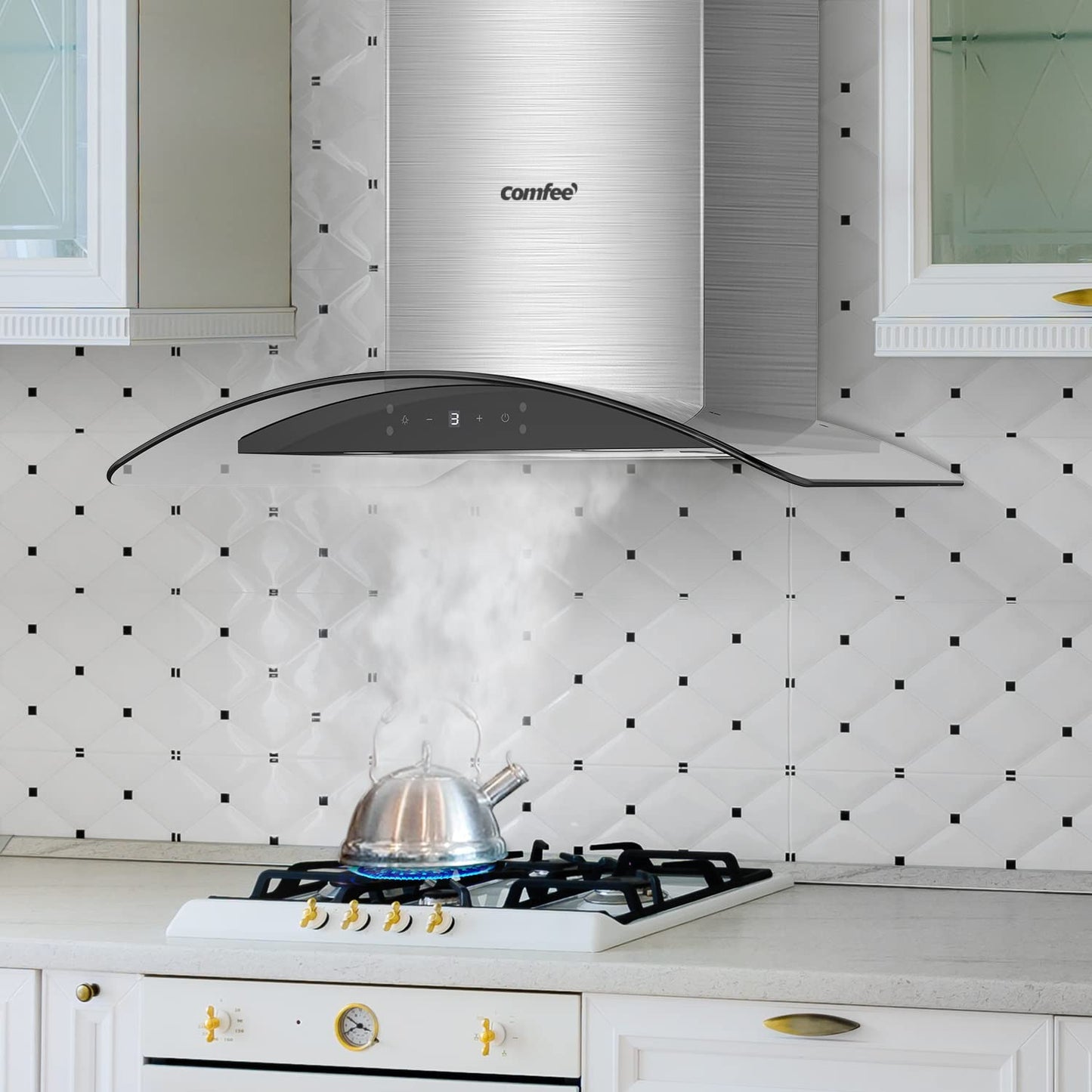 wall mount ducted range hood sucking smoke from a kettle on a oven