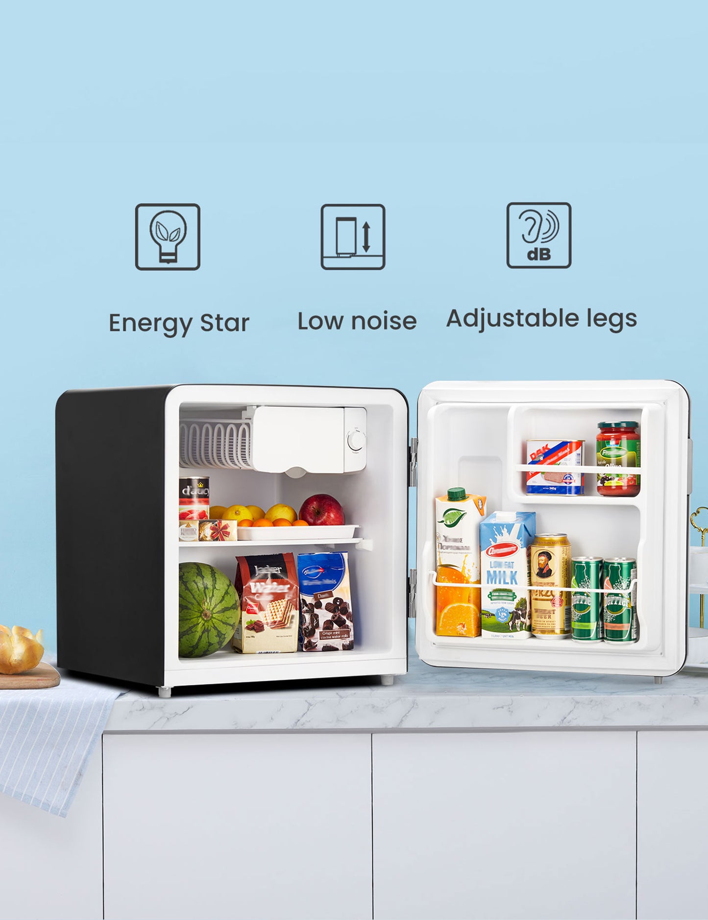 open mini fridge with cartons of drinks and fruits inside
