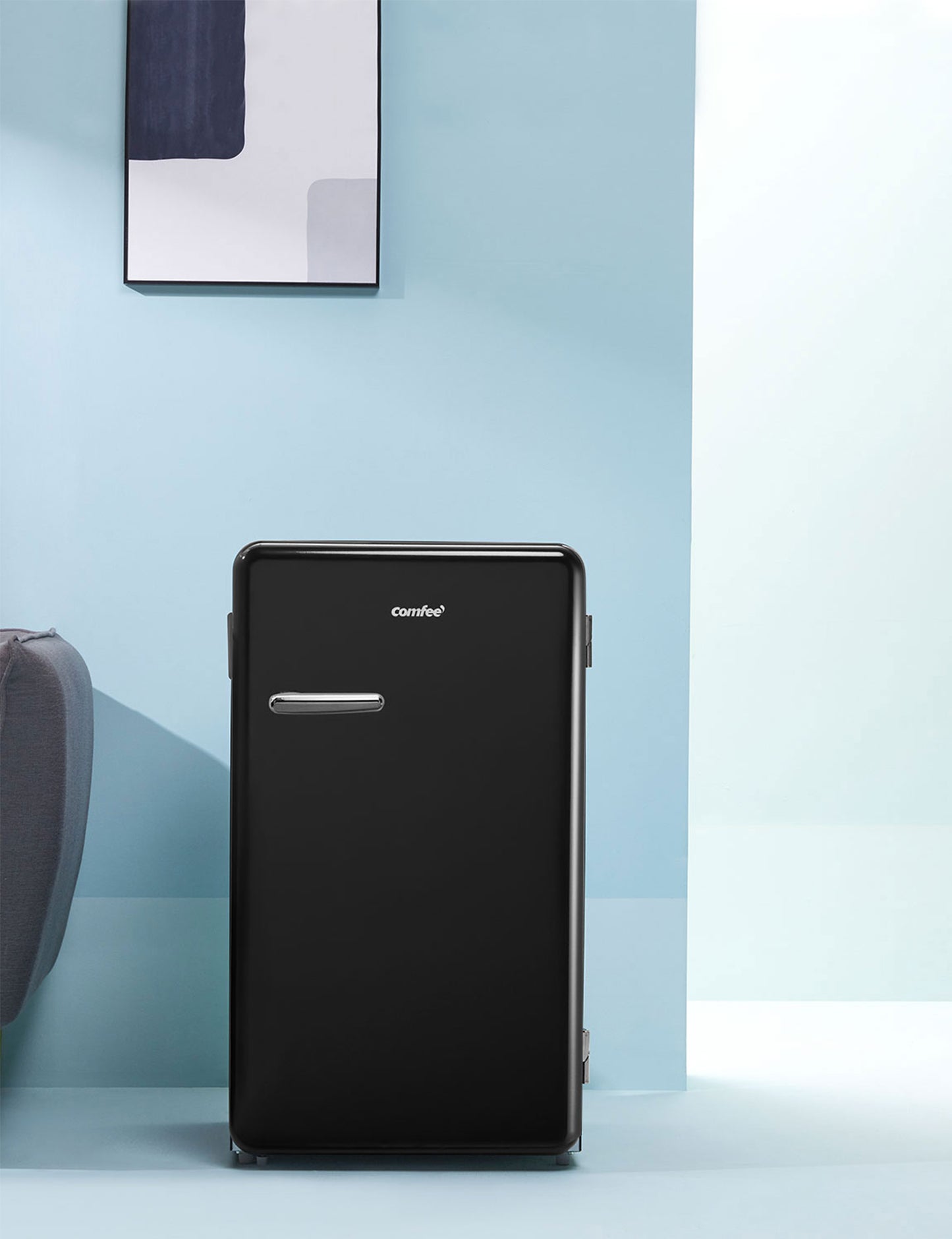 black comfee fridge in a blue modern interior