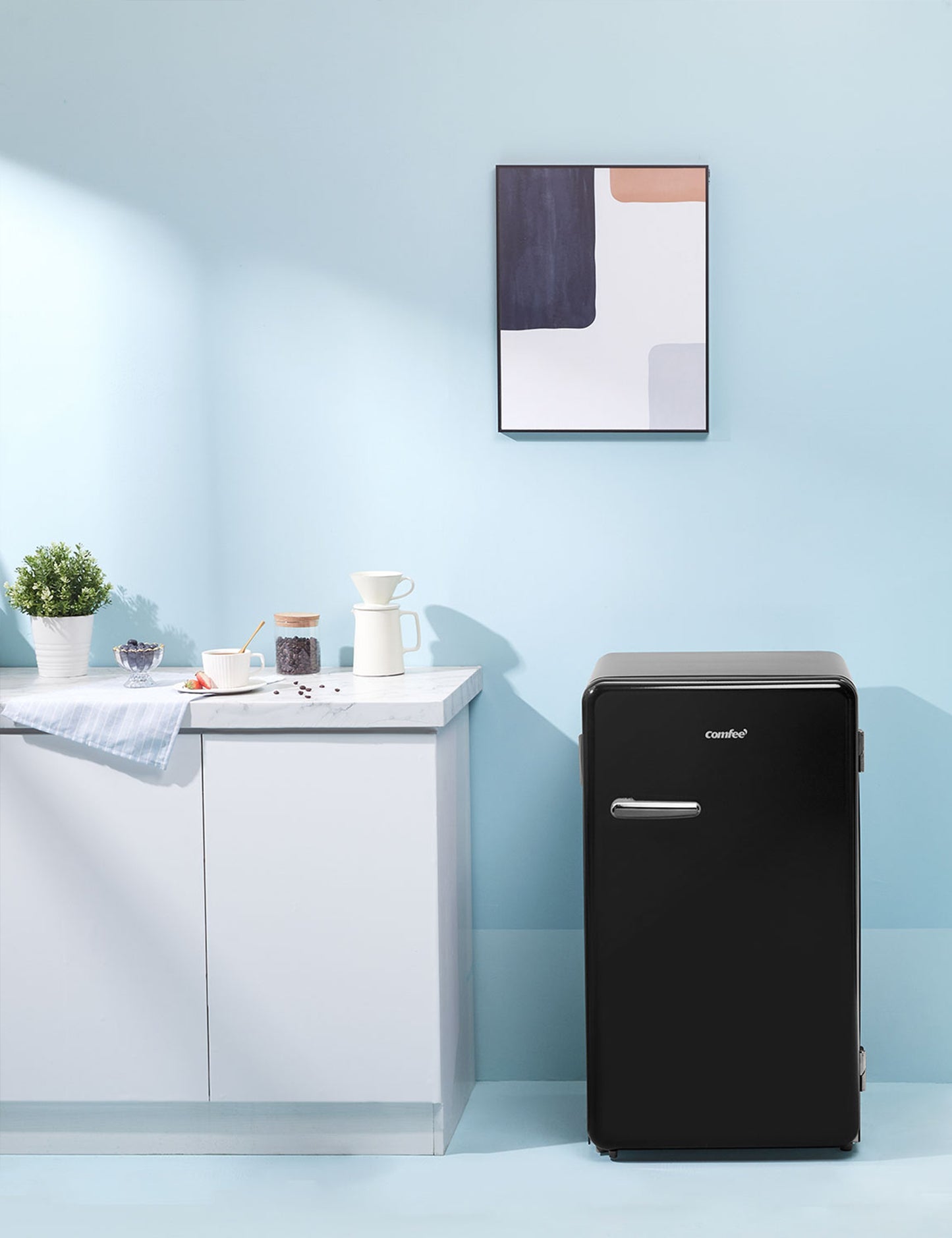 black compact refrigerator in a modern interior