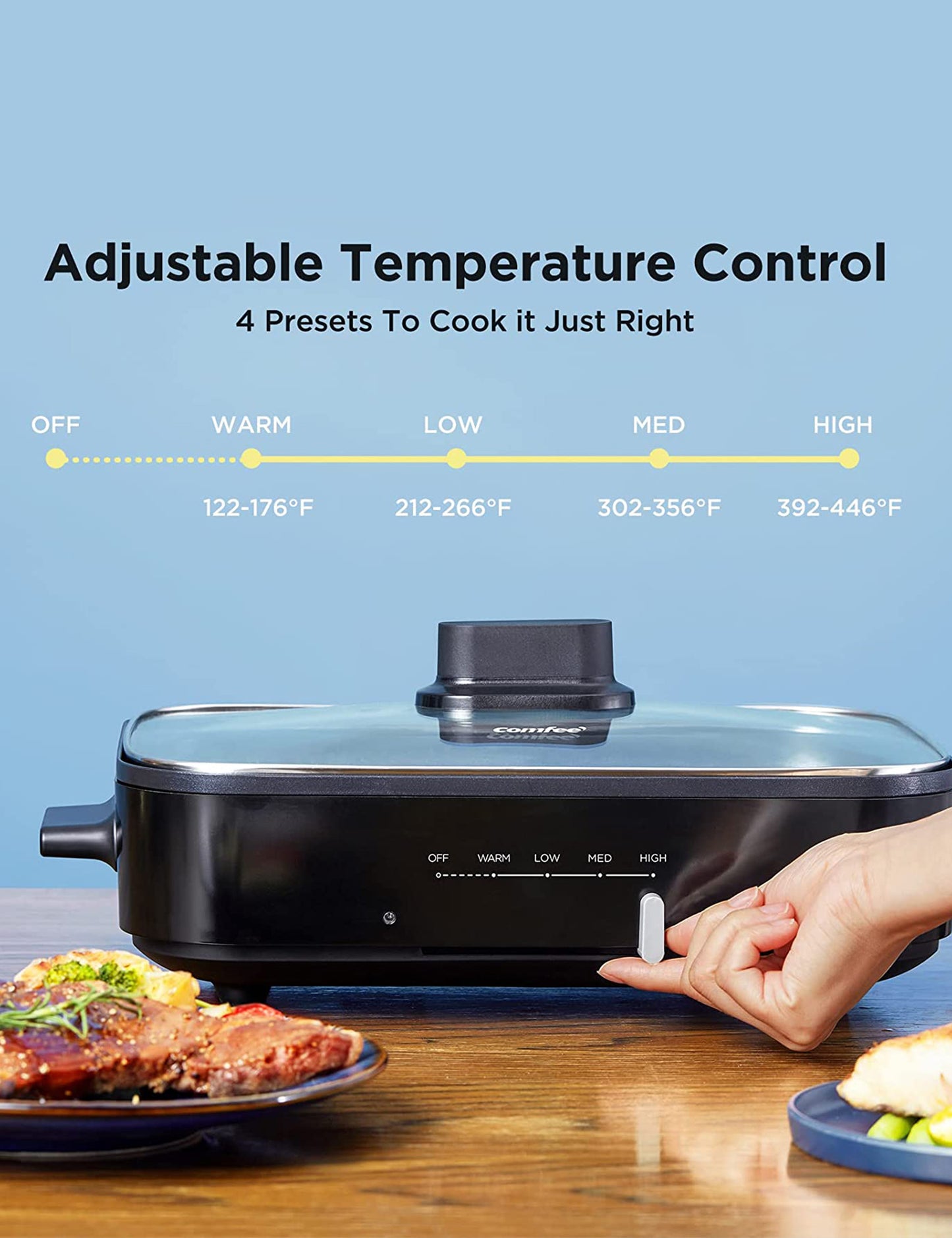 hand adjusting the heat level on the comfee electric skillet