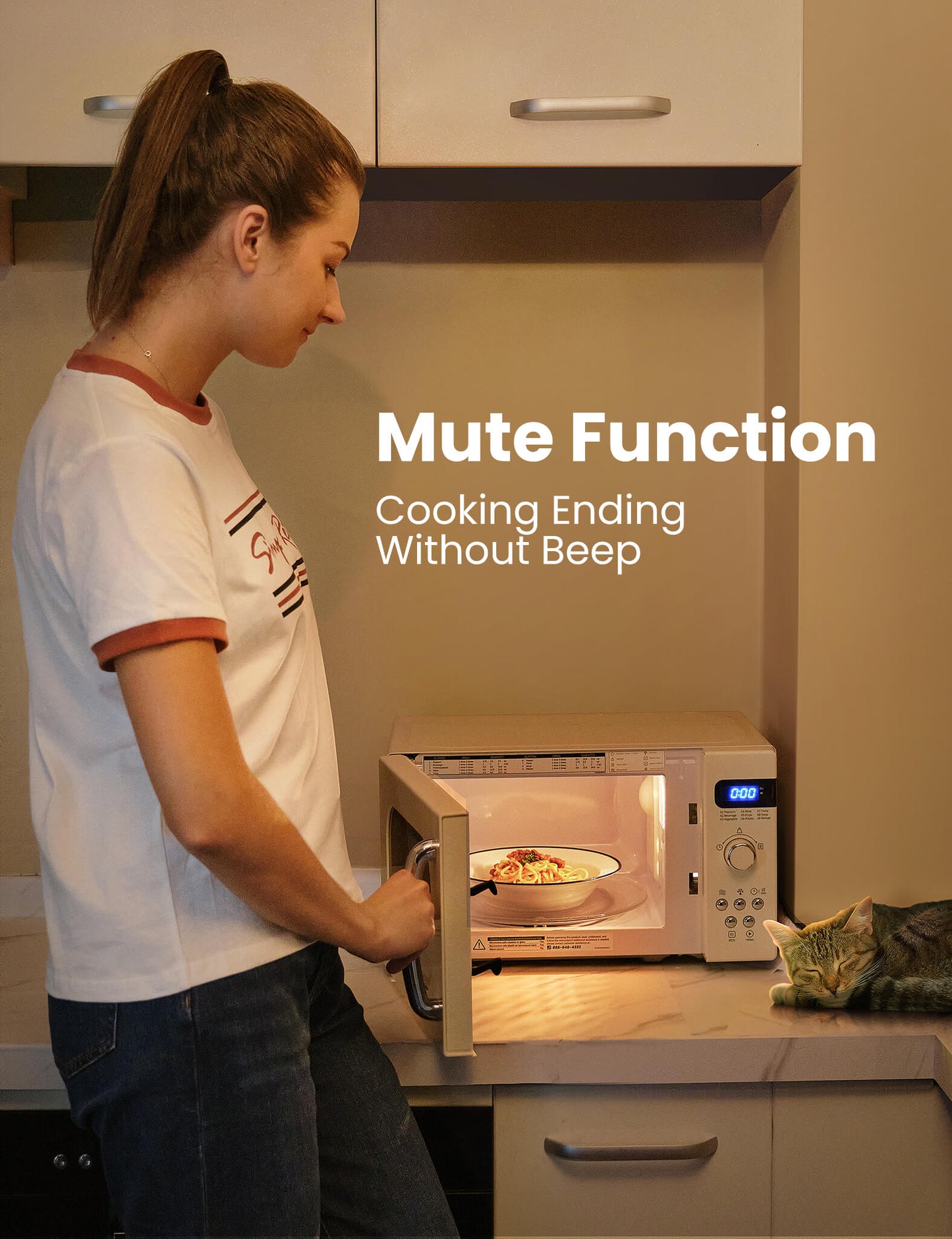 a sleeping cat next with a microwave