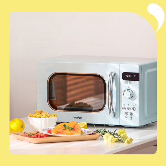 retro microwave oven with some food next to it