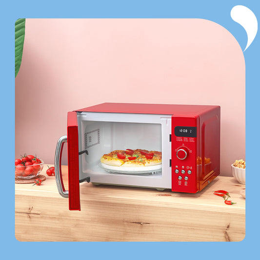 A pizza in the open red microwave oven