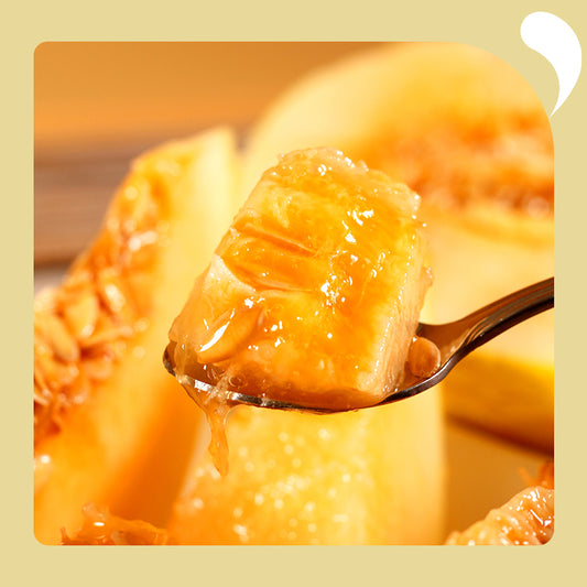 a spoonful of honeydew melon cubes