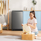 someone folding clothes near comfee washing machine