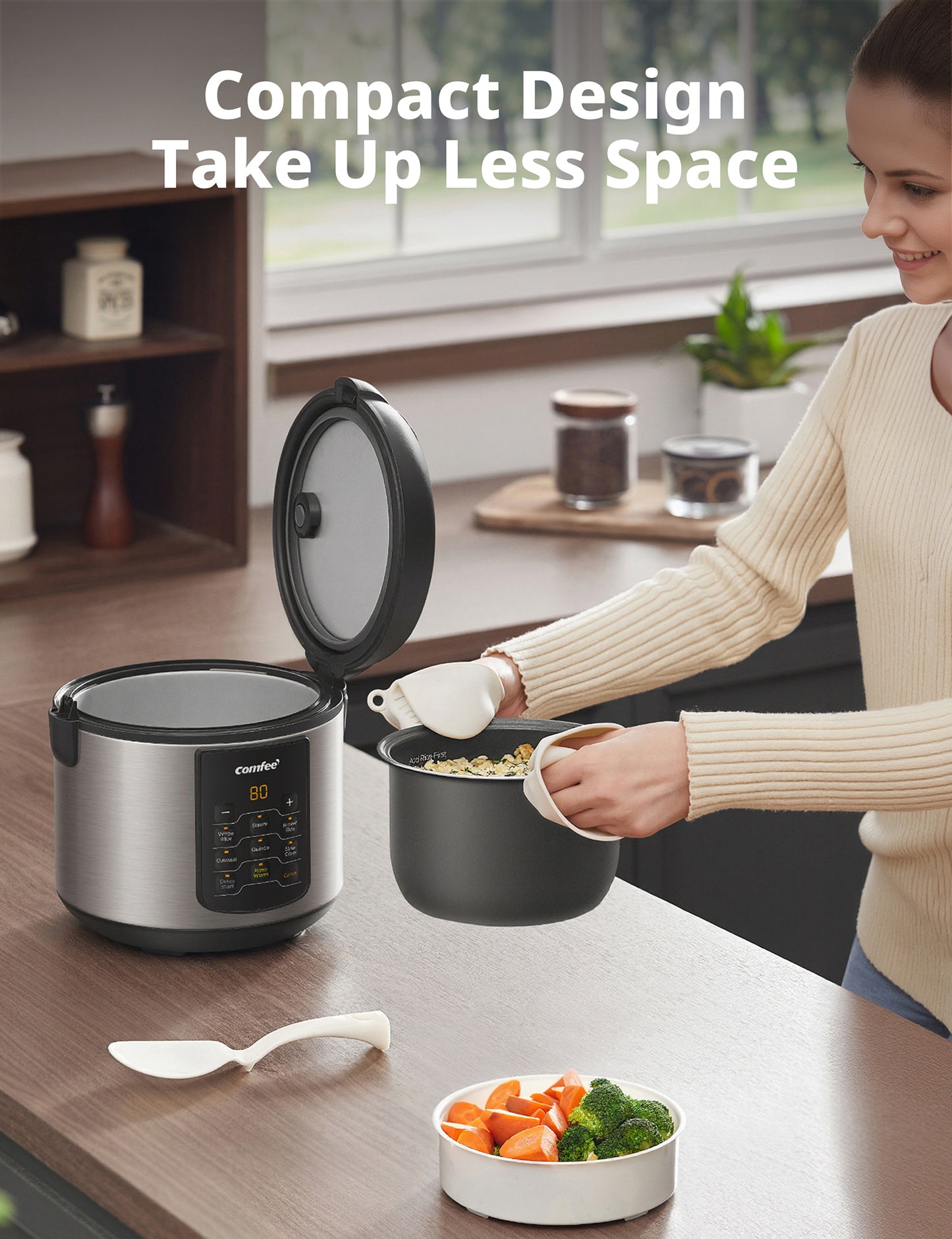 Compact Comfee 2-Quart Stainless Steel Rice Cooker with removable pot, displayed in a modern kitchen.