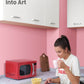 A woman with a glass of water looking at her phone, popcorn in front of her, and a red microwave oven next to her