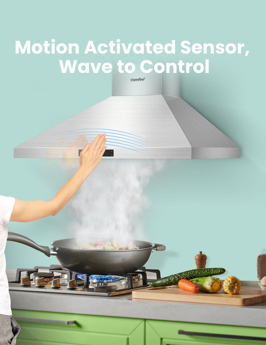 comfee hand wave control range hood sucking steam from a pot of food on a stove
