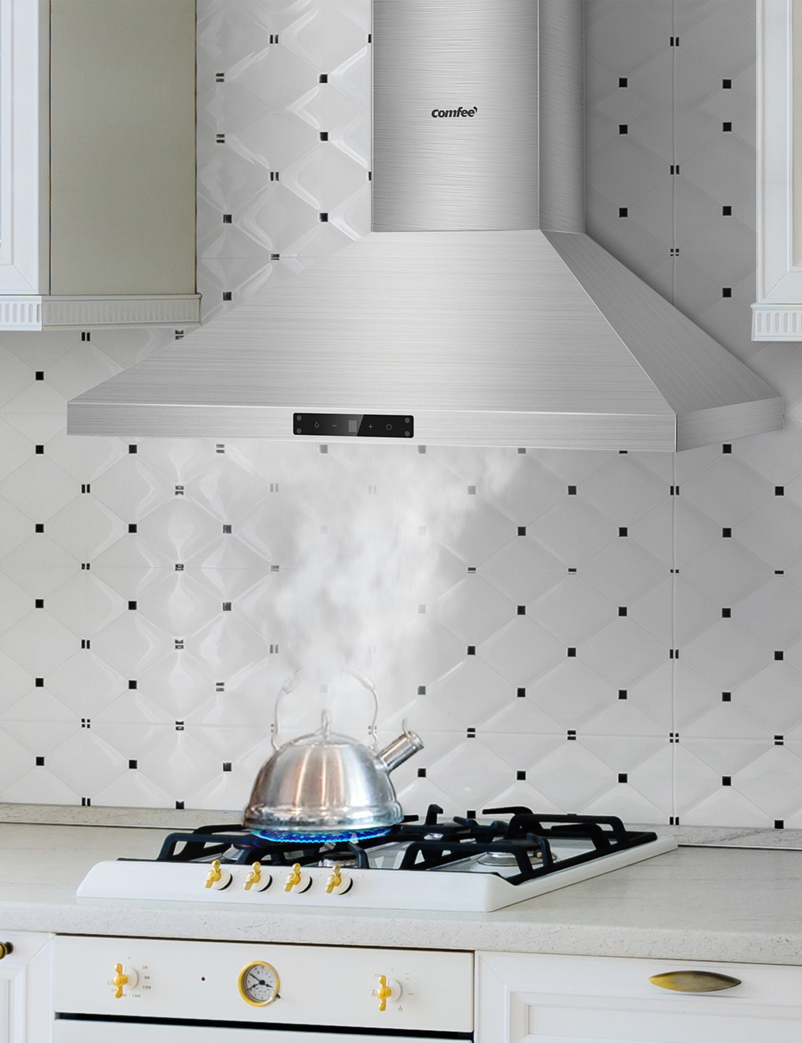 wall mount ducted range hood sucking smoke from a kettle on a oven