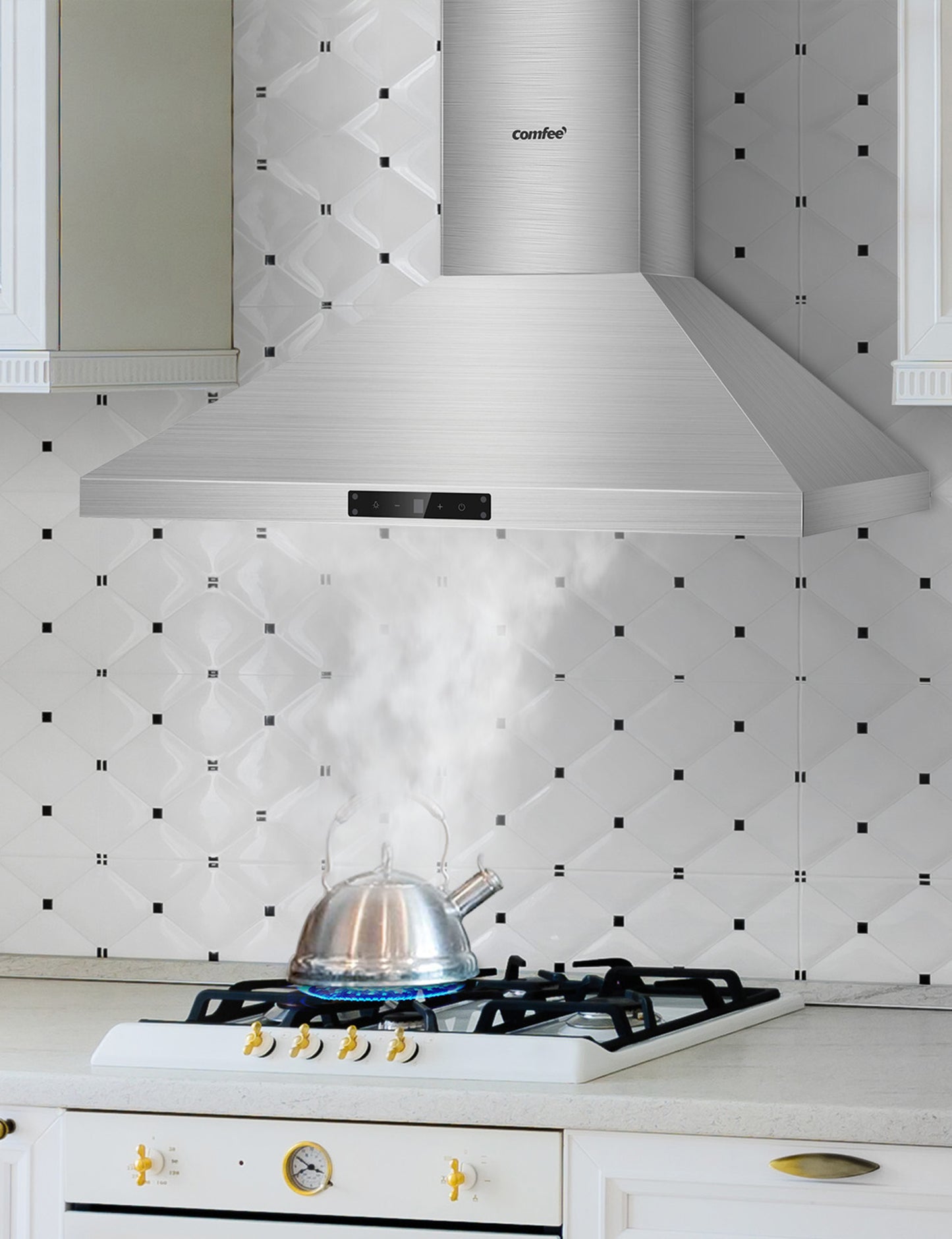 wall mount ducted range hood sucking smoke from a kettle on a oven