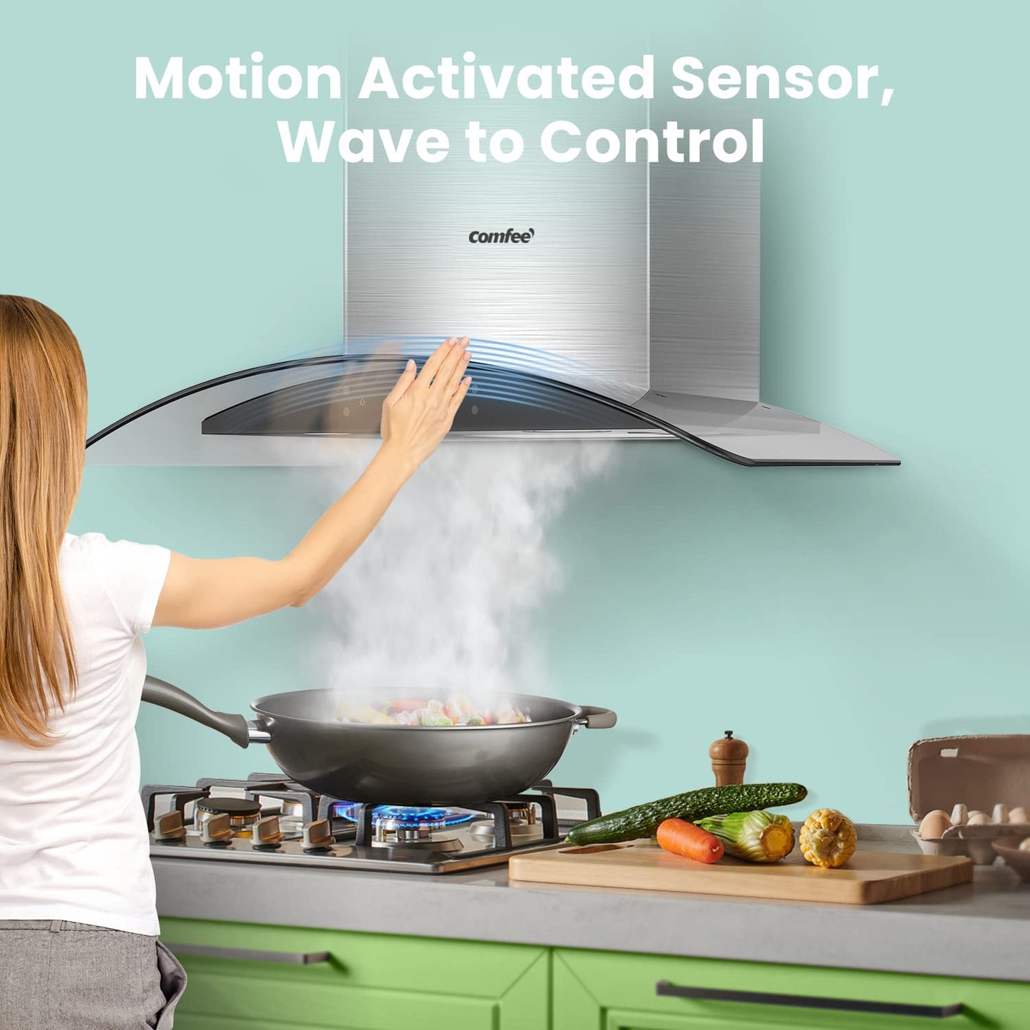 comfee hand wave control range hood sucking steam from a pot of food on a stove