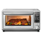 Comfee air fryer toaster oven with a whole beef being cooked inside