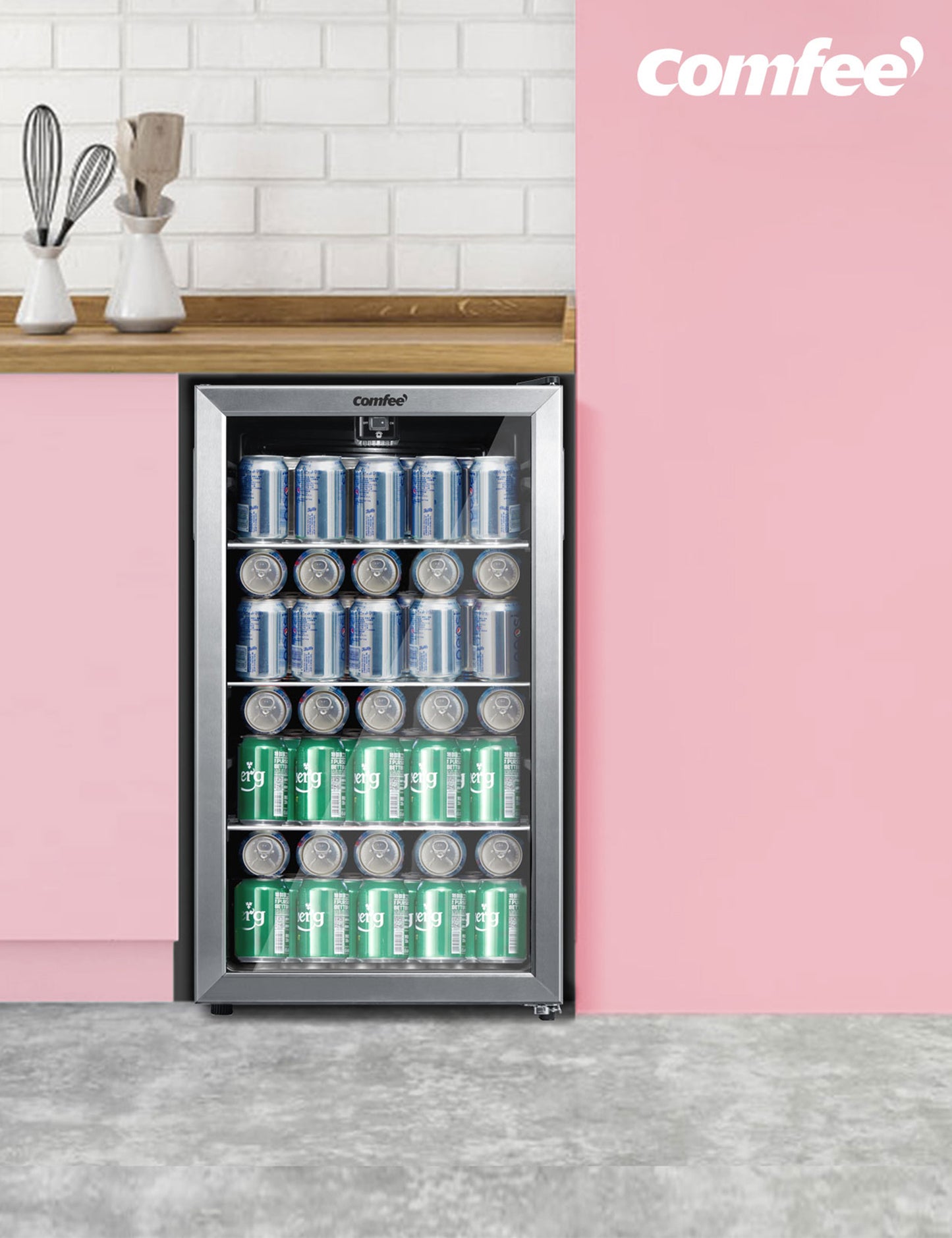 silver undercounter beverage cooler in a pink kitchen