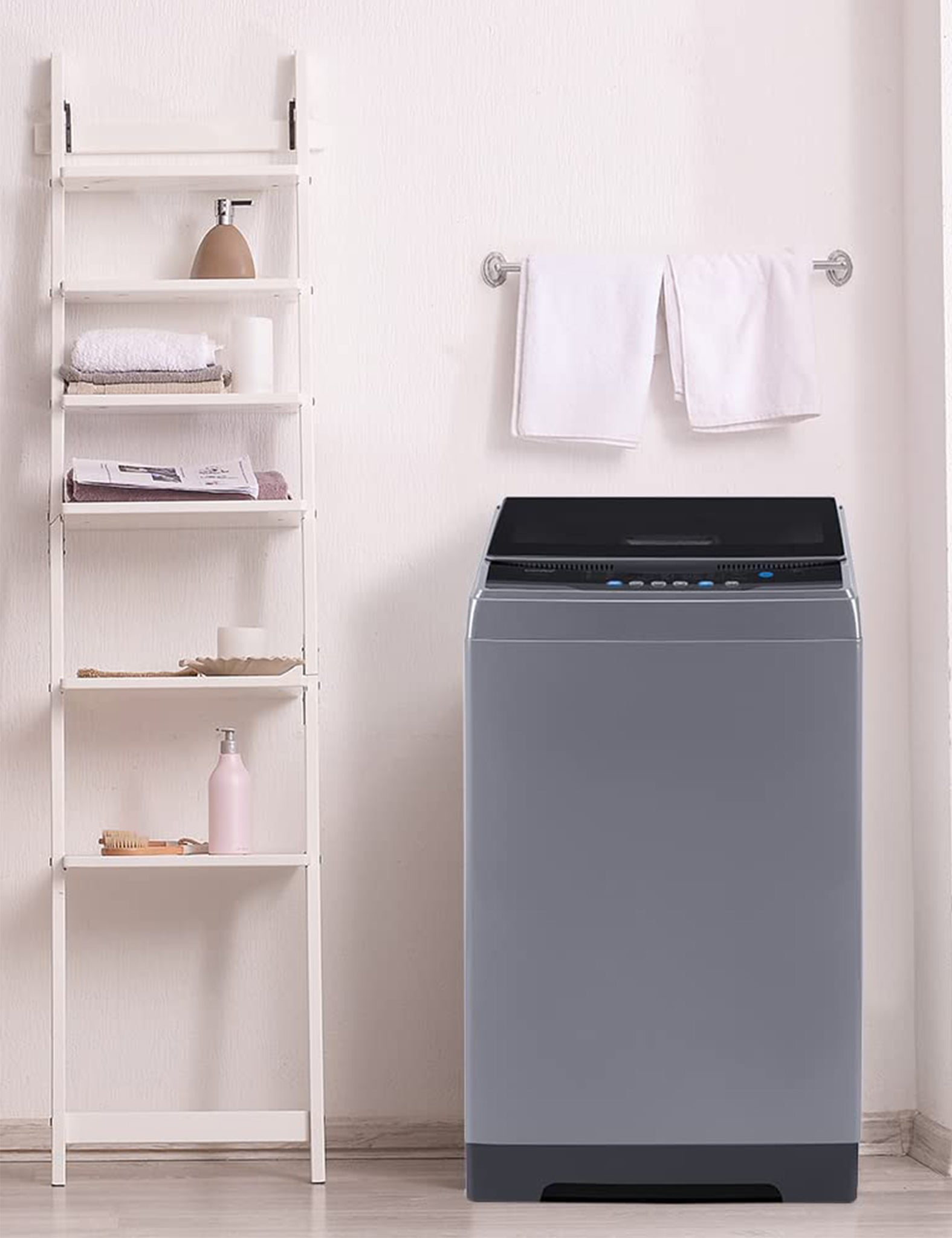 grey portable comfee washing machine in a laundry room
