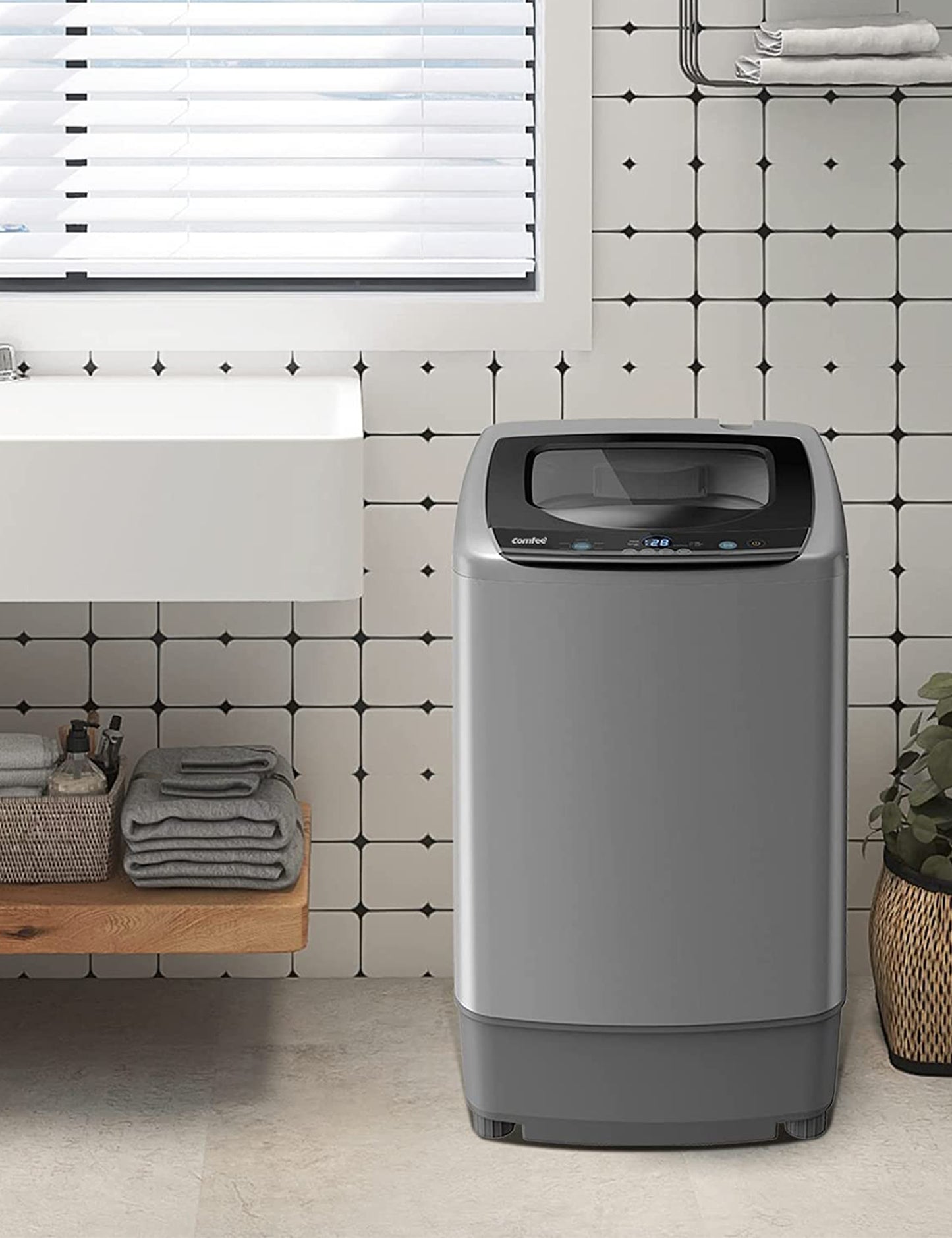 grey portable washing machine in a bathroom