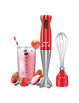 red comfee electric hand blender next to a cup of tomato juice and a whisk head