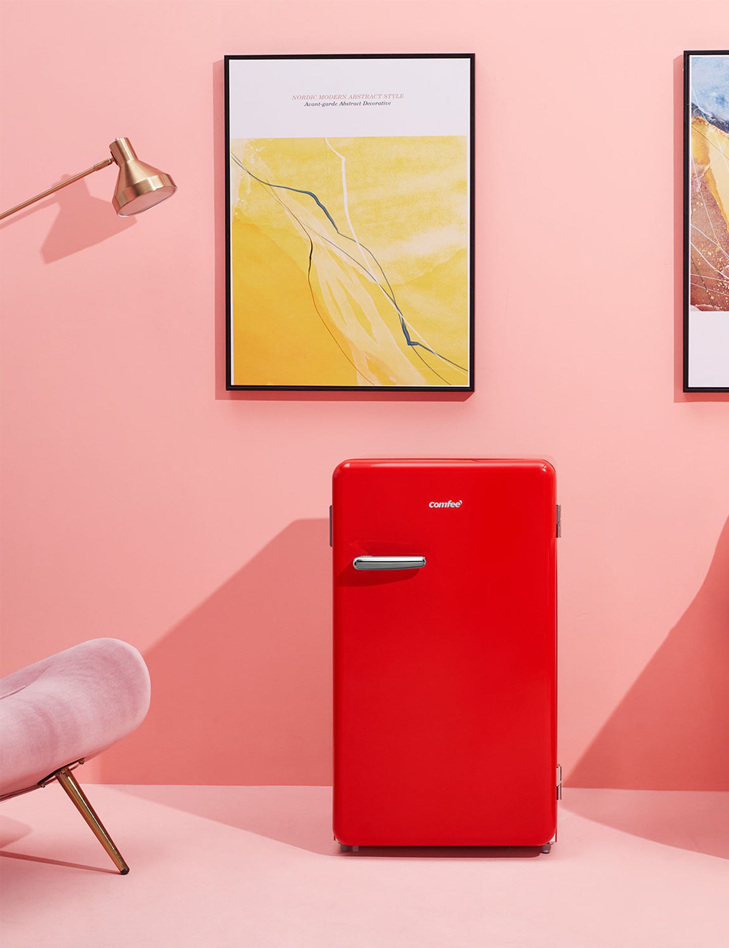 red retro style refrigerator in a stylish pink interior next to a pink couch